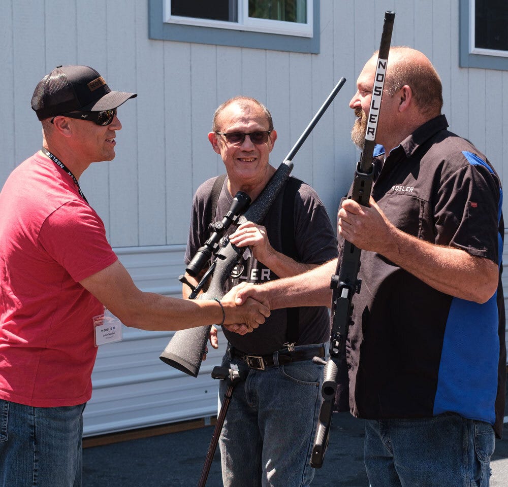 President John Nosler Presents Bill Patterson and Michael Hoover with 30- Year Work Anniversary Rifles